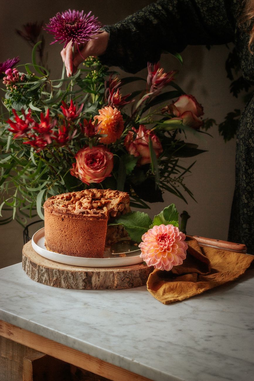 A custom-decorated celebration cake on a rustic wooden table